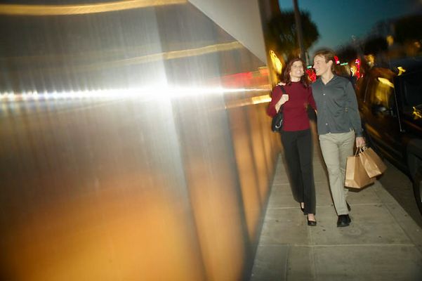 Adult couple walking together with shopping bags uid 1437921.jpg