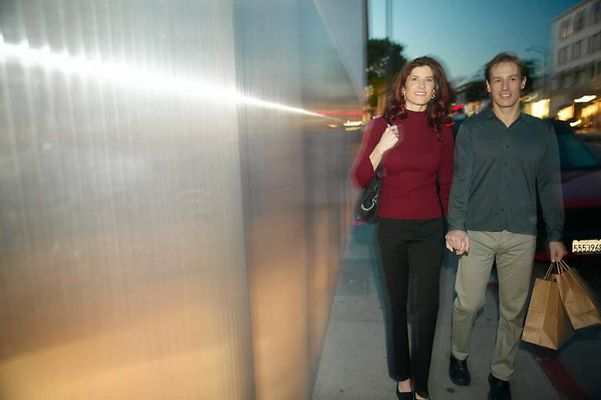 Adult couple walking together with shopping bags uid 1437928.jpg