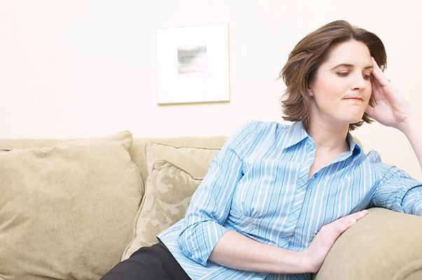 Angry woman sitting on couch.jpg
