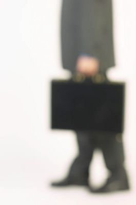 Blur of businessman holding briefcase 2.jpg