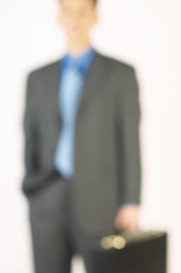 Blur of businessman holding briefcase 3.jpg