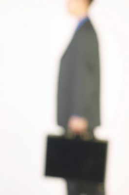 Blur of businessman holding briefcase.jpg