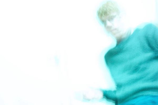 Blur of man wearing green sweater.jpg