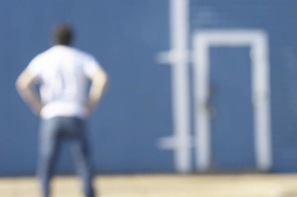 Blur of person standing in front of blue and white barn.jpg