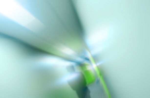 Blur of person walking down gray hallway.jpg