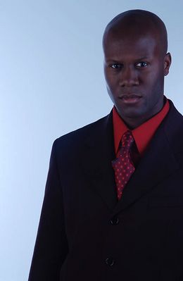 Businessman in black suit and red shirt 2.jpg