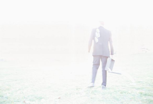 Businessman standing in field with open briefcase 1.jpg