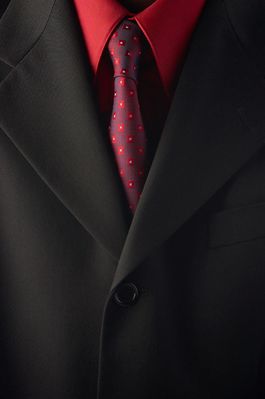 Businessman wearing red shirt and tie under black suit 1.jpg