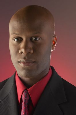 Businessman wearing red shirt and tie under black suit 100.jpg