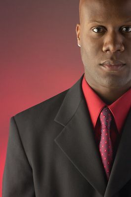 Businessman wearing red shirt and tie under black suit 2.jpg