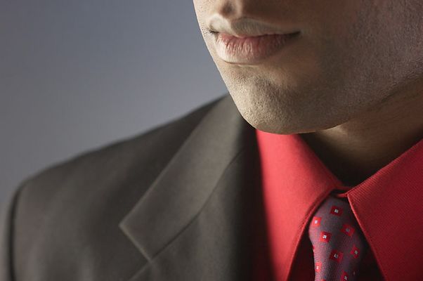 Businessman wearing red shirt and tie.jpg