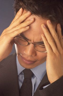 Businessman with a headache 3.jpg