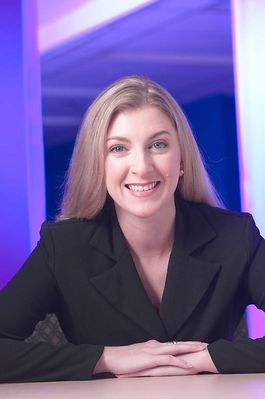 Caucasian business woman leaning on desk an 1.jpg