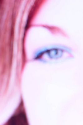 Close up of woman eye wearing blue eye shadow.jpg
