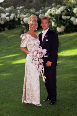 Couple standing by flowers.jpg