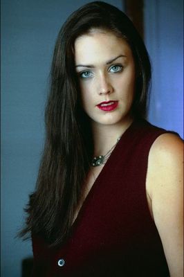 Dark haired woman in ruby vest.jpg