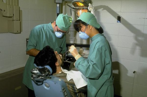 Dentist and assistant working on patient.jpg