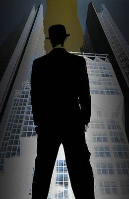 Man in suit and bowler hat standing in front of skyscraper.jpg
