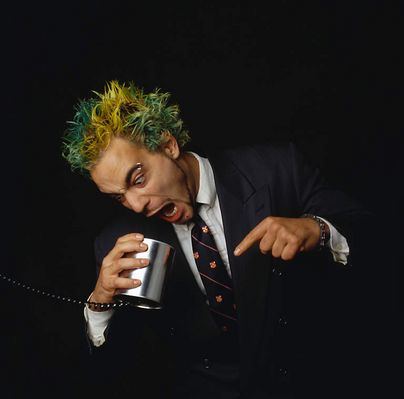 Man yelling into a tin cup.jpg