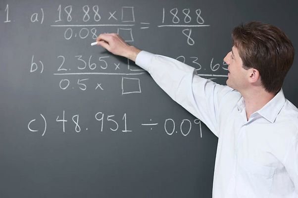 Math teacher at blackboard.jpg