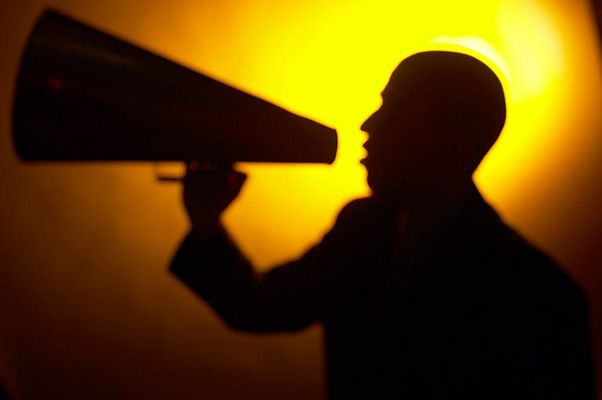 Silhouette of man yelling into a bullhorn 1.jpg