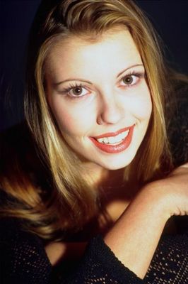 Smiling woman with long brown hair.jpg