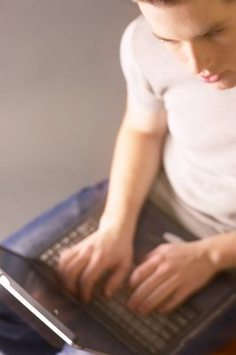 Teenaged boy working on laptop computer 2.jpg