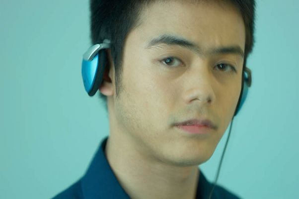 Thoughtful man listening to music on headphones 2.jpg