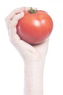 Tomato in outstretched hand.jpg