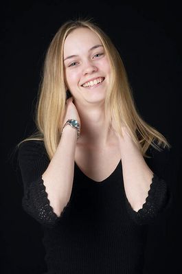 Woman in front of black background uid 1426770.jpg