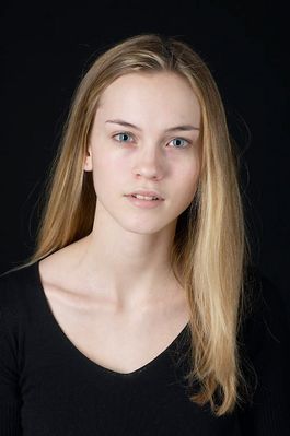 Woman in front of black background uid 1426777.jpg