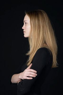 Woman in front of black background uid 1426784.jpg