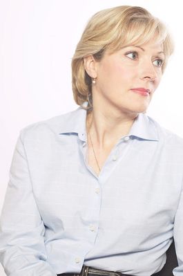 Woman in light blue shirt looking off to the side.jpg