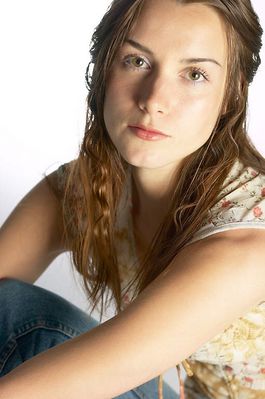 Woman sitting in jeans and floral top a810.jpg