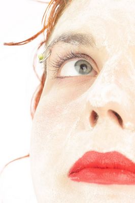 Woman wearing white facial mask.jpg