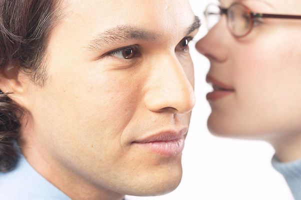 Woman whispering secret into man ear 3 c103125.jpg