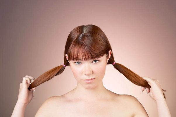 Woman with bare shoulders and pigtails uid 1284716.jpg