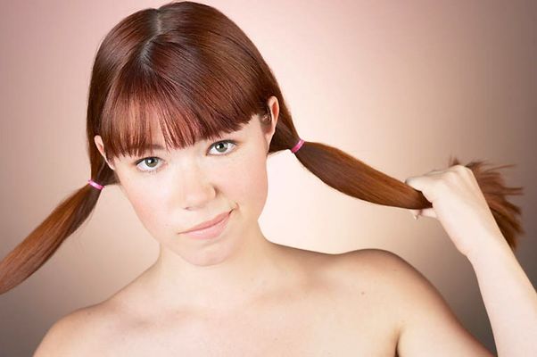 Woman with bare shoulders and pigtails uid 1284717.jpg
