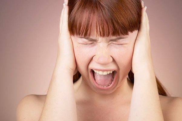 Woman with bare shoulders having temper tantrum.jpg