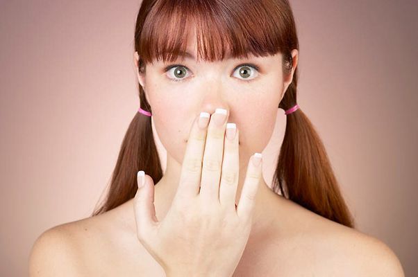 Woman with bare shoulders looking surprised uid 1284722.jpg