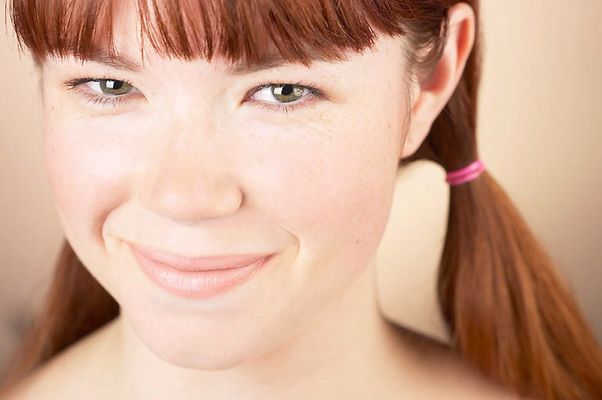Woman with bare shoulders smiling.jpg