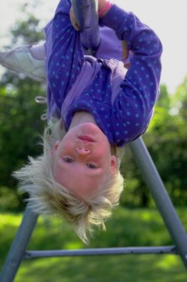 Young child hanging from pole.jpg