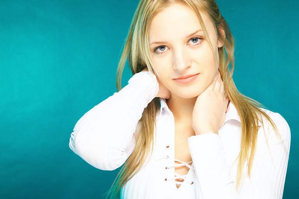 Young girl rubbing her neck uid 1430310.jpg