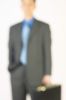 Blur of businessman holding briefcase 3.jpg