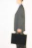 Blur of businessman holding briefcase.jpg