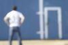 Blur of person standing in front of blue and white barn.jpg