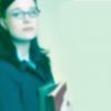 Blur of woman in glasses holding books.jpg