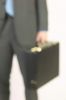 Businessman hand holding briefcase 1.jpg