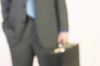 Businessman hand holding briefcase 2.jpg