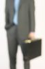 Businessman hand holding briefcase 3.jpg